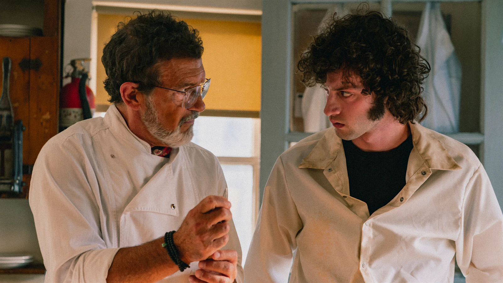 Still from the Anthony Bourdain biopic, “Tony” showing Antonio Banderas and Dominic Sessa.
